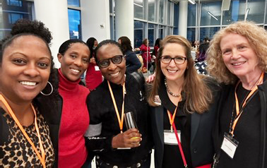 Danika Ali (left) and Tina Herrara and Catherine Hickey (right) with YWCA leaders from Rwanda.